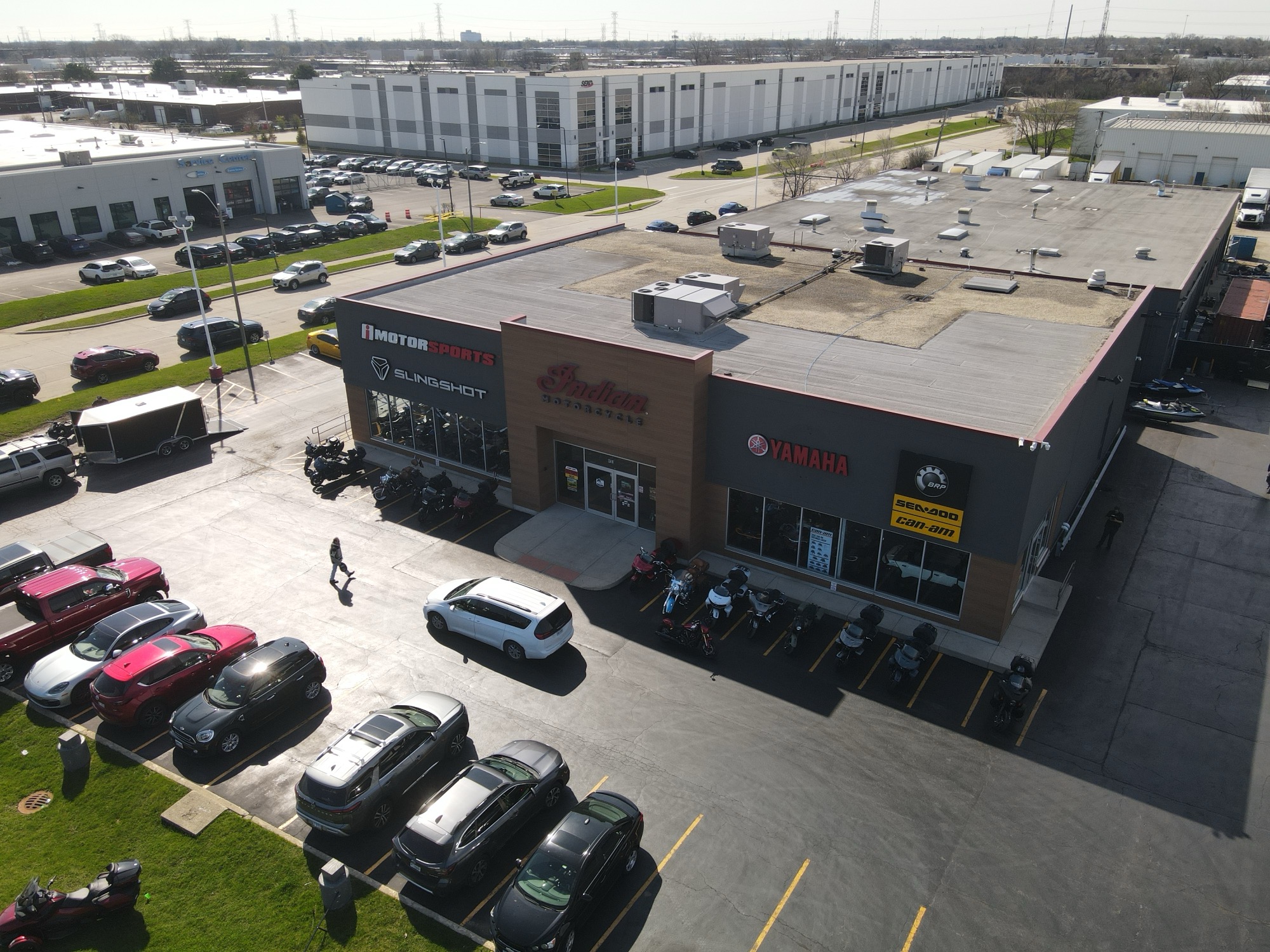 iMotorsports Chicago Elmhurst showroom — aerial drone view of the facility and brand signage