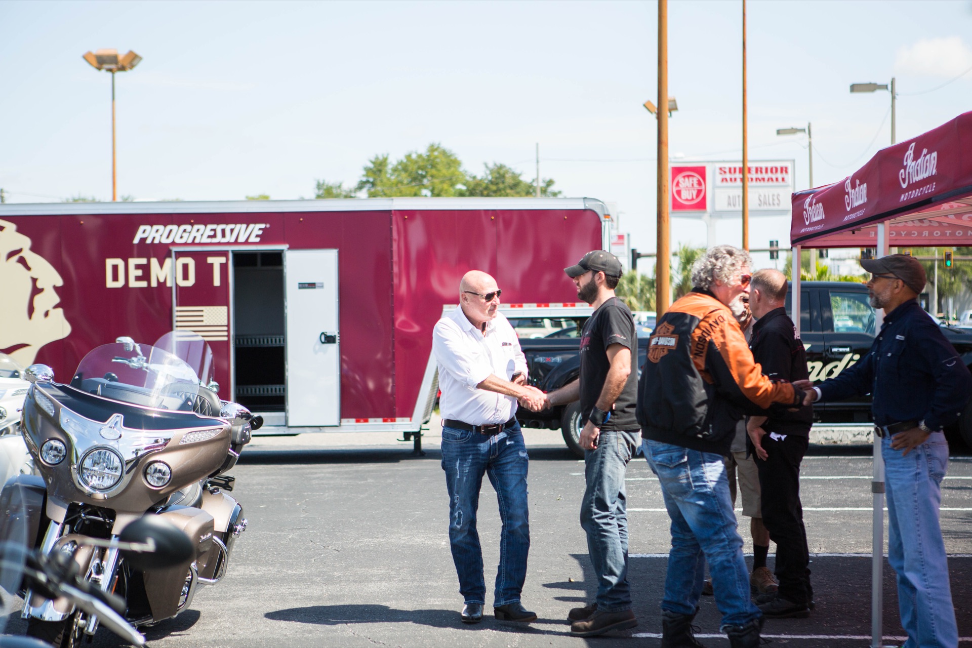 iMotorsports team member shaking hands with customers